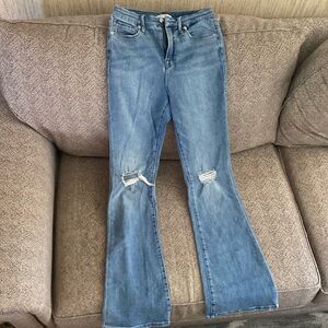 Medium wash bootleg jeans.